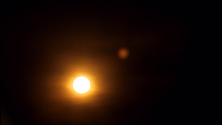 The Sun Rises over a Black Sky